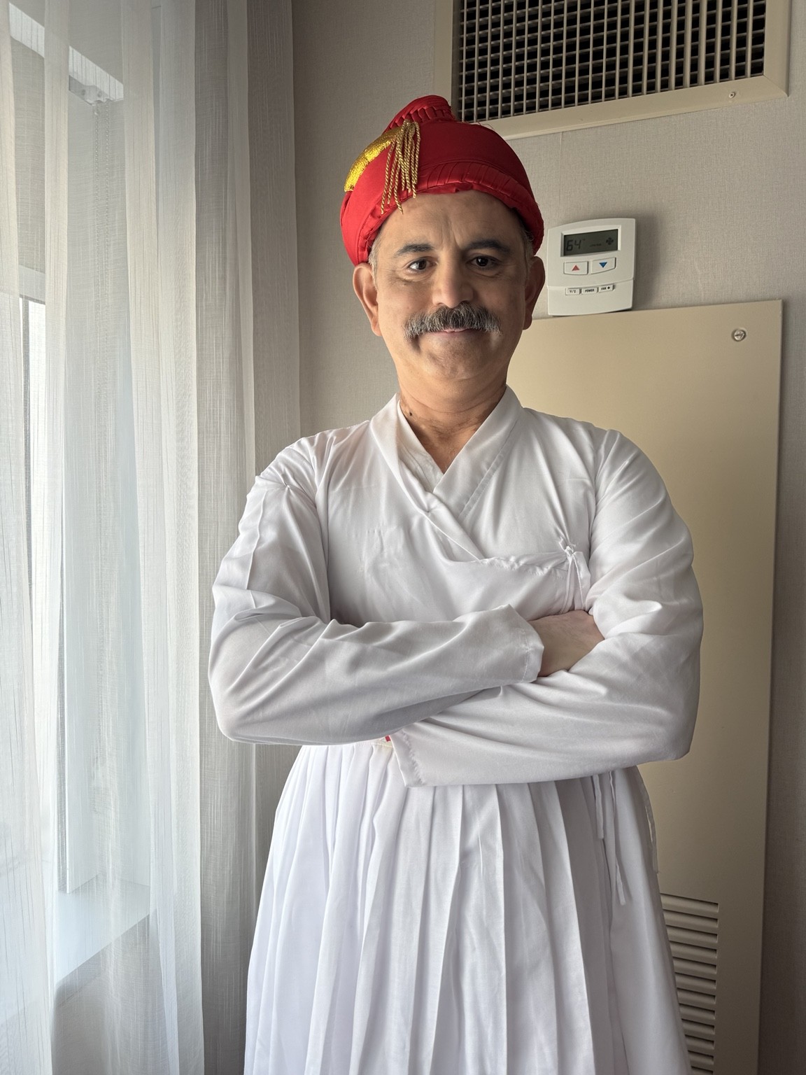 Abhay Dharmadhikari in a red pagadi and white historical costume